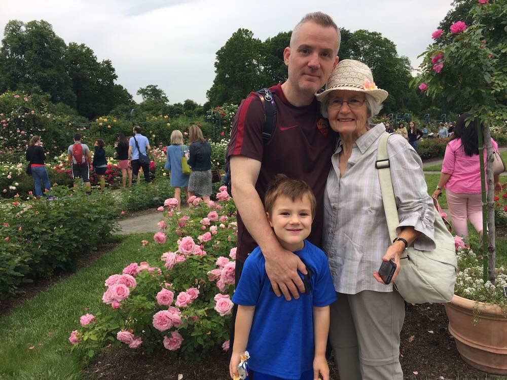 KONVOY Brand Lead Will, his Mom Mary Jo, and son Oliver smiling in Bronx Botanical Gardens